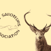 A pale yellow background with a stag's head on the right. Next to it on the left is the Hunt Saboteurs Association fox logo