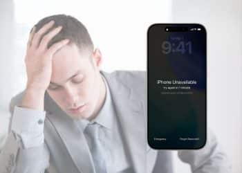 A man with his head in his hands and a locked iPhone