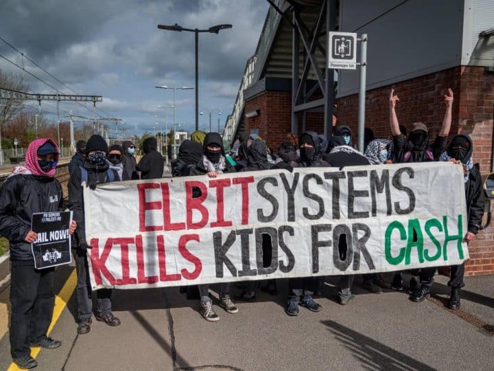Actionists near Filton hold banner saying Elbit Systems kills kids