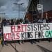 Actionists near Filton hold banner saying Elbit Systems kills kids