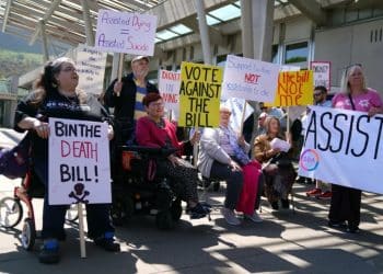 Members of Glasgow Disability Alliance protest against the Assisted Dying (Scotland) Bill