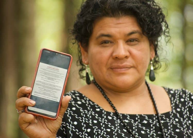 Maya Q’eqchi leader Lesbia Artola shows a screenshot of a social media smear campaign