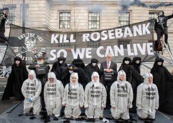 Protesters in fron of a banner reading Kill Rosebank So We Can Live
