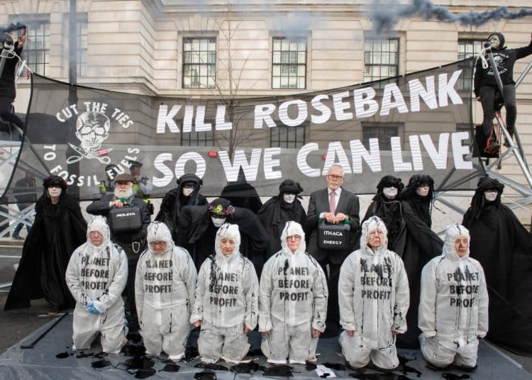 Protesters in fron of a banner reading Kill Rosebank So We Can Live