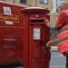 Royal Mail van, postbox and postal worker