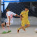 Gaza - Two young footballers from opposing teams chase the ball