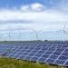 Solar farm in front of wind turbines Renewable energy