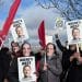 Protesters wearing Wes Streeting masks hold signs saying Where's Wes?