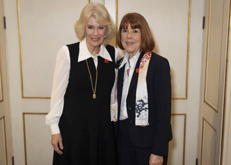 queen camilla stands with gisele pelicot