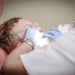 private dentists - a dentist examines the teeth of a young boy