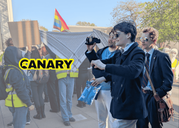 Picture of newly ratified York University Restore Britain Society members filming and jeering at student protesters. The Canary logo is on the left and in the background is an image of protesters holding up Keffiyehs to hide attendees.