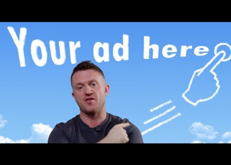 Tommy Robinson with a sign behind him which reads 'your ad here'