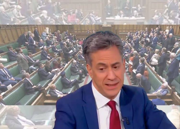 Ed Miliband in front of an image of parliament