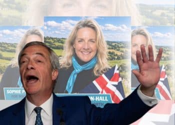 Nigel Farage in front of a candidate's flyer Reform