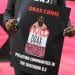 Dr Krystal Martin Holds Placard in Front of Drax AGM