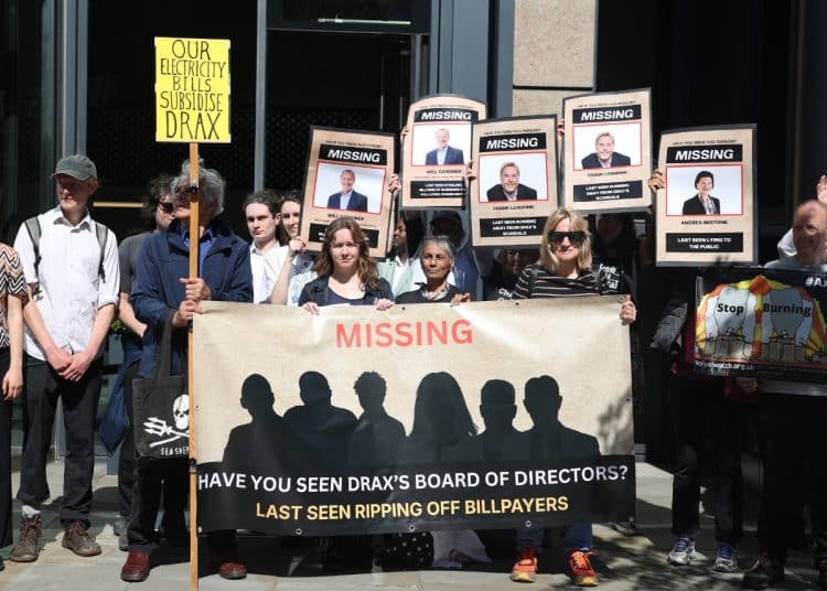 Activists outside the Drax AGM, calling attention to the absent board members