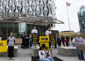 Fossil Fuel London campaigners outside US Embassy in London protesting oil company profits due to Trump war on Iran