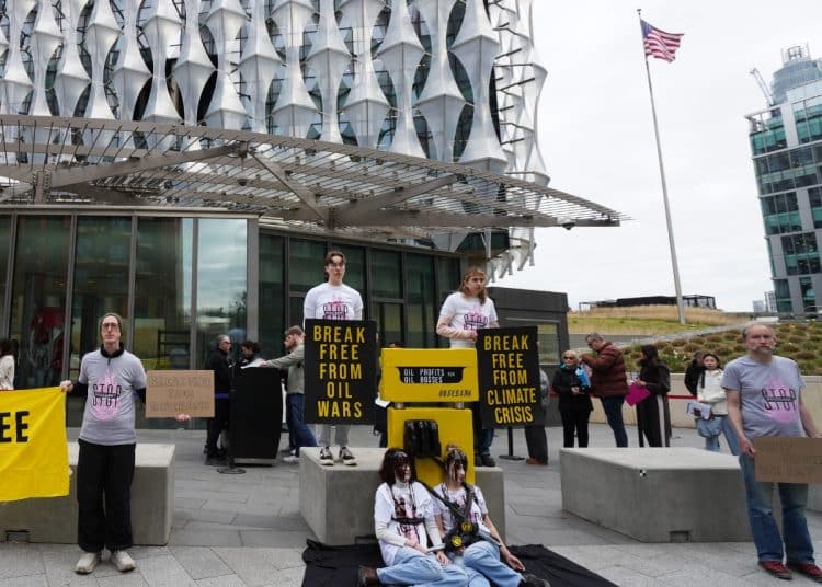 Fossil Fuel London campaigners outside US Embassy in London protesting oil company profits due to Trump war on Iran