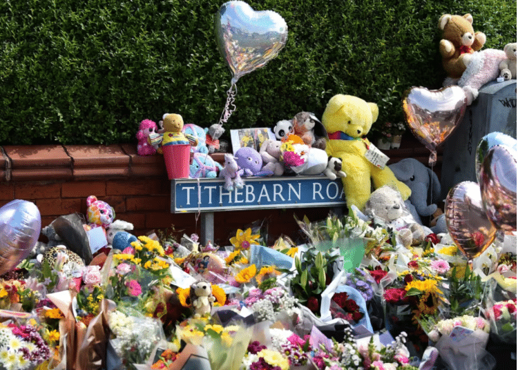 Floral tributes, balloons and teddy bears pile up against one another in Tithebarn Road, Southport on 31 July 2024.