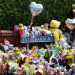 Floral tributes, balloons and teddy bears pile up against one another in Tithebarn Road, Southport on 31 July 2024.