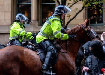 Police on horseback riding into supporters of Resist Britain First in Manchester