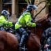 Police on horseback riding into supporters of Resist Britain First in Manchester