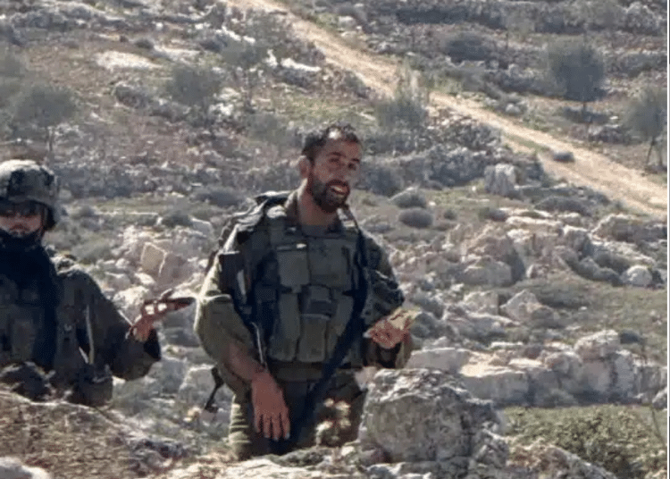 Israeli occupation soldiers photographed against a backdrop of rocky hills in April 2026