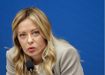 Italy Prime Minister Giorgia Meloni speaking into a microphone