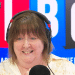 LBC host Shelagh Fogarty infront of her radio mic, talking to guest, Steve, on her show