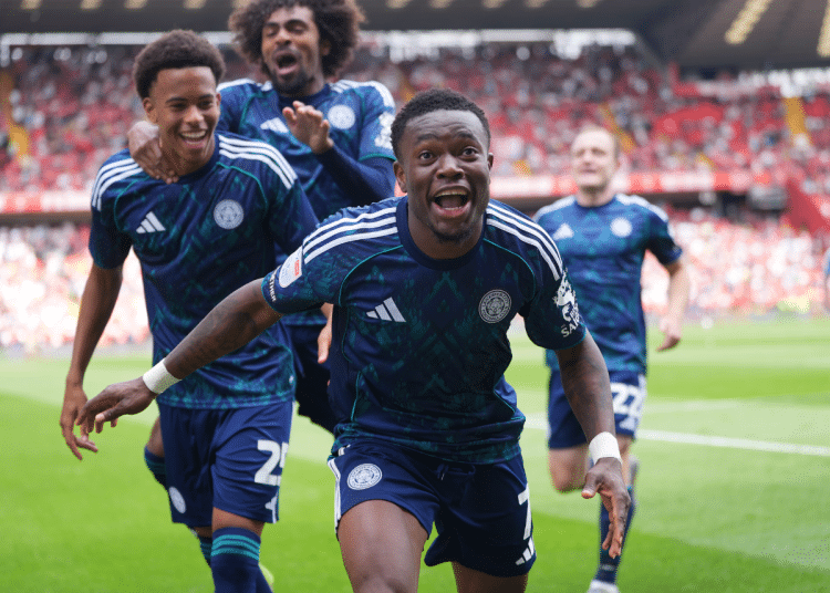 Abdul Fatawu celebrates with his Leicester teammates after scoring the winner against Charlton in August 2025. His mouth is open as he runs towards the photographer and his two teammates smile and laugh behind him