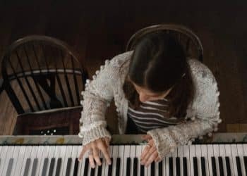 A girl plays a piano in a publicity still from 'Little Rock', from the Dementia Doesn’t Care campaign