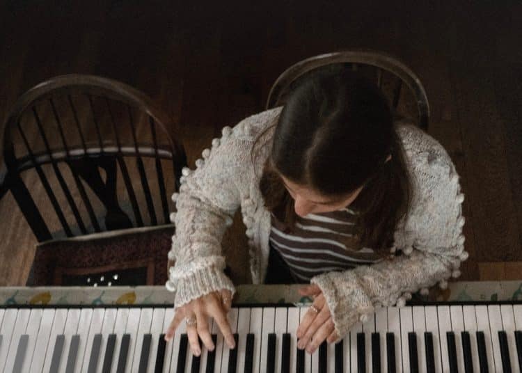 A girl plays a piano in a publicity still from 'Little Rock', from the Dementia Doesn’t Care campaign