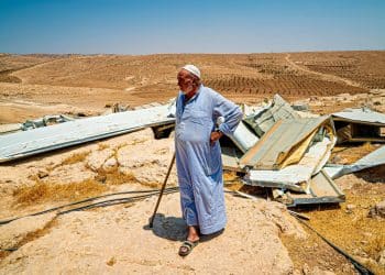 A resident of the Masafer Yatta community looks over his demolished home in 2022