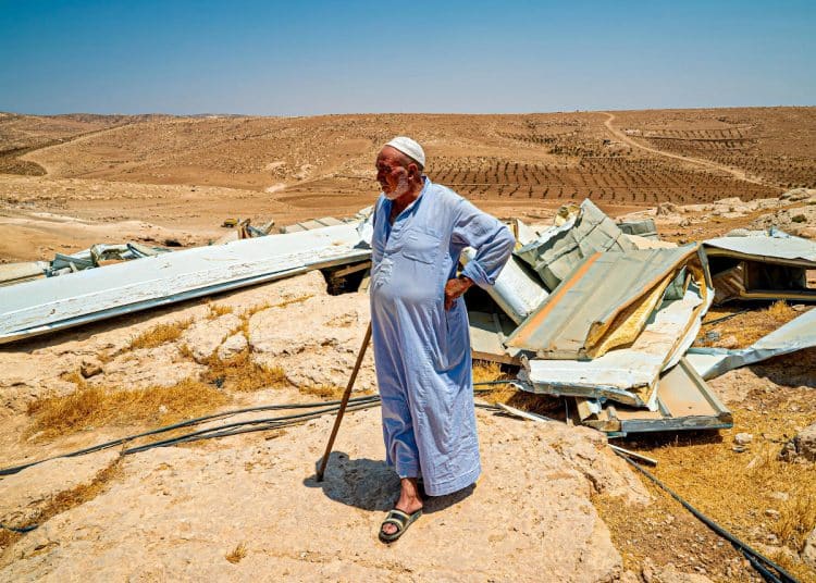 A resident of the Masafer Yatta community looks over his demolished home in 2022