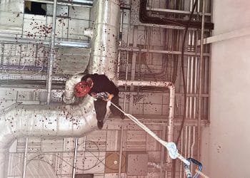 A person abseils into the UAV Tactical Systems factory in Leicester