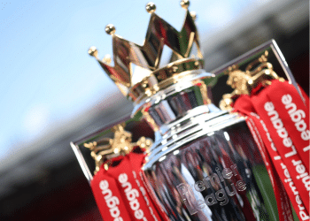 A close-up of the regal looking Premier League trophy that has 'Premier League' engraved into the silver at the front and tassels hanging from the sides