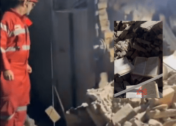 Rafi Niya synagogue in Tehran, Iran. A main photo is a screenshot of a video showing emergency workers wearing high-vis overalls standing on rubble. An inset photo shows books and paper, religious texts, on top of rubble.