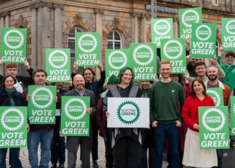 Scottish Greens holding placards