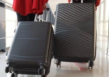 People dragging suitcases More young Britons leaving the UK