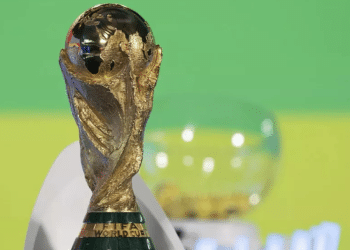 The World Cup trophy shines against a colourful background