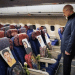 A man looks at photos of the children lost in the Minab tragedy in Iran