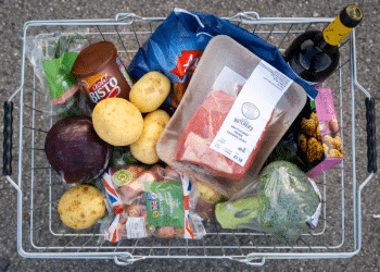 In this photo illustration, a basket of shopping filled with produce used in a traditional Sunday roast dinner for families is displayed on October 23, 2022 in Cardiff, Wales. The cost of a home-cooked Sunday roast for a family of four has reached its highest level in over a decade with inflation at 10.1%.
