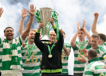Martin O'Neill, Interim Manager of Celtic lifts the William Hill Premiership trophy with players of Celtic following the team's victory in the William Hill Premiership match between Celtic and Heart of Midlothian at Celtic Park on May 16, 2026 in Glasgow, Scotland.