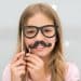 Child with a fake moustache and glasses to get around age verification