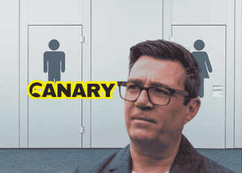 burnham Public toilet doors in the background. Andy Burnham, head and shoulders in the foreground looking perplexed. The Canary logo is on the left hand side.