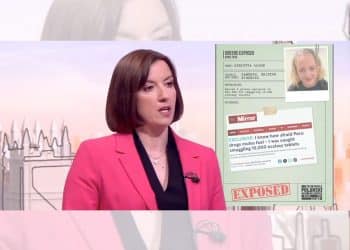 Bridget Phillipson in front of a Labour smear poster