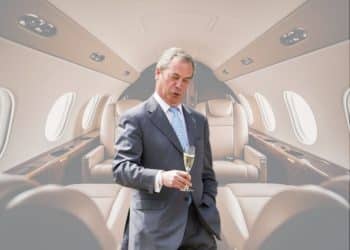 Nigel Farage in front of an image of a private jet