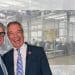 A graphic showing a photograph of Malcolm Offord and Nigel Farage, of Reform, in front of a detention centre.