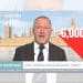 Steve Reed in front of text which reads '-6,000' Labour