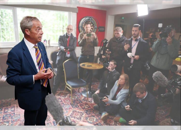 Reform leader Nigel Farage in a room full of journalists